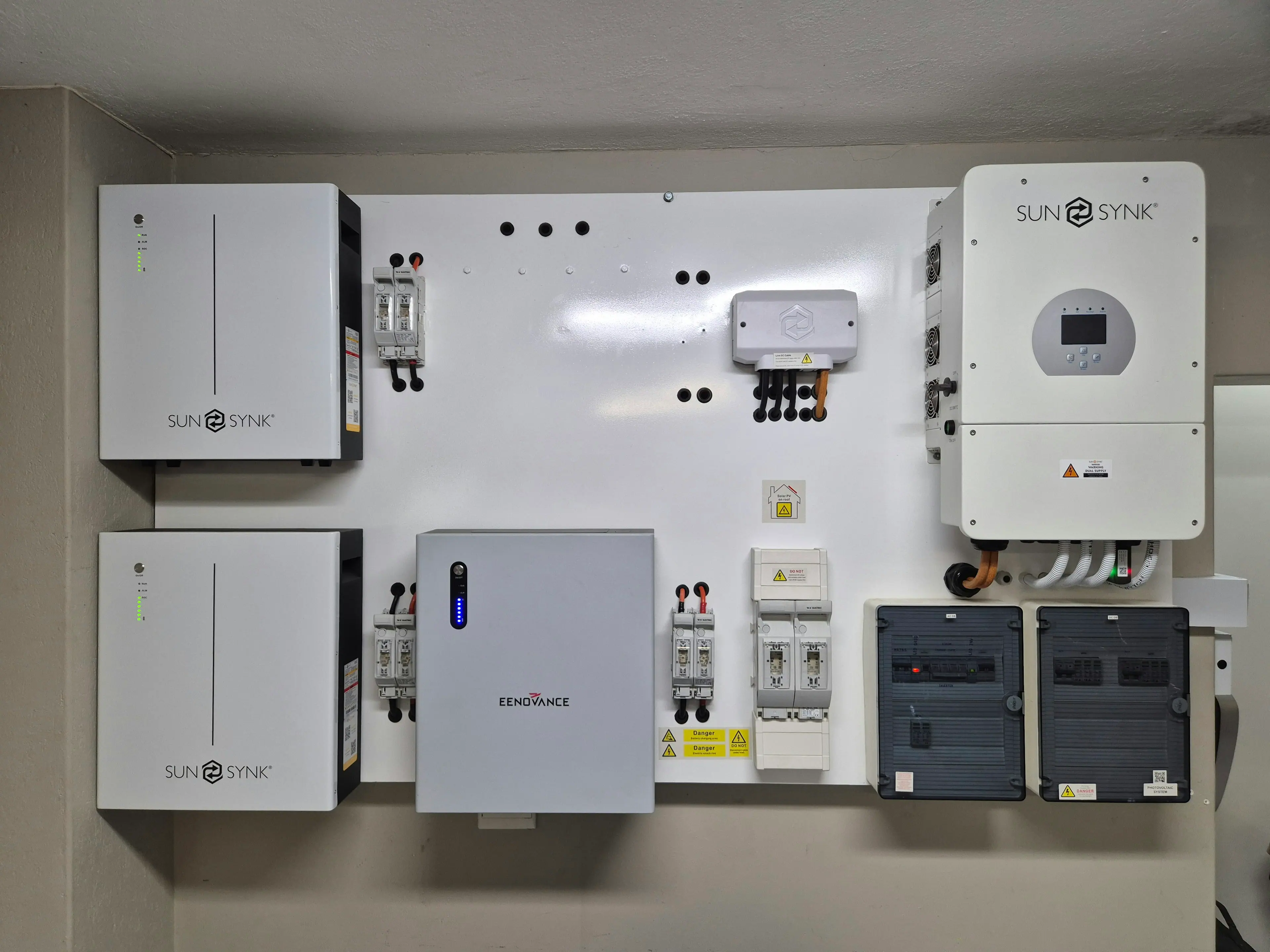 Hybrid solar inverter and lithium battery storage mounted on a wall